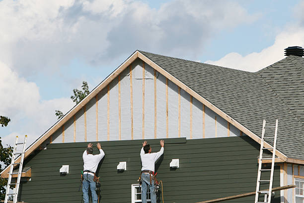 Professional Siding Installation technician working in Roanoke, IL